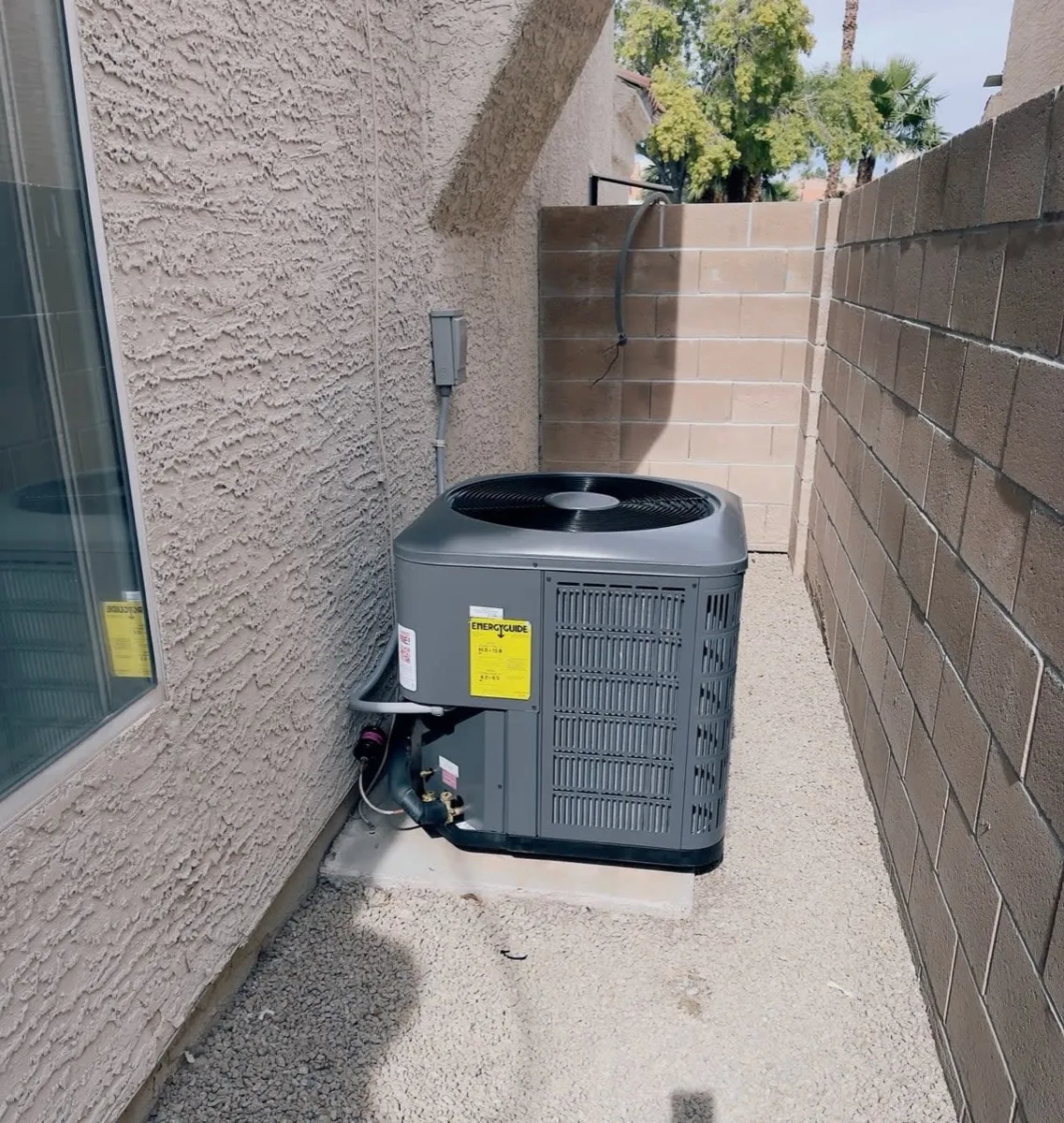 Airtemp condenser unit installed at a Henderson home on desert gravel